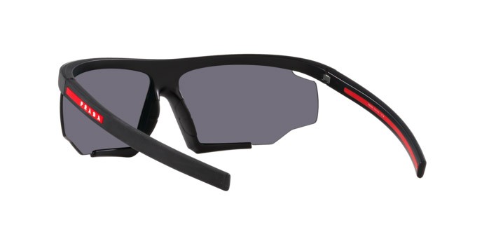 Occhiali da sole Prada Linea Rossa PS 07YS (DG010A) colore nero effetto gommato forma irregolare lenti arancione a specchio
