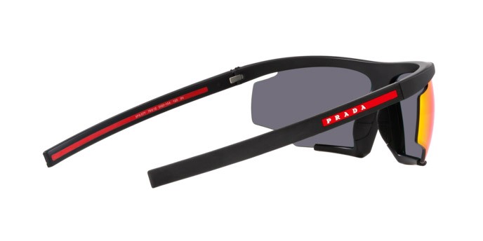 Occhiali da sole Prada Linea Rossa PS 07YS (DG010A) colore nero effetto gommato forma irregolare lenti arancione a specchio