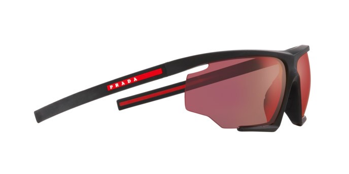Occhiali da sole Prada Linea Rossa PS 07YS (DG010A) colore nero effetto gommato forma irregolare lenti arancione a specchio