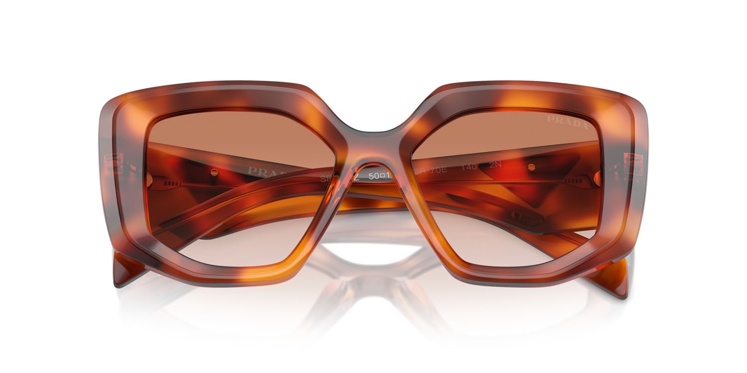 Sunglasses Prada PR 14ZS (18R70E) color cognac tartarugato shape irregular lenses marrone sfumato