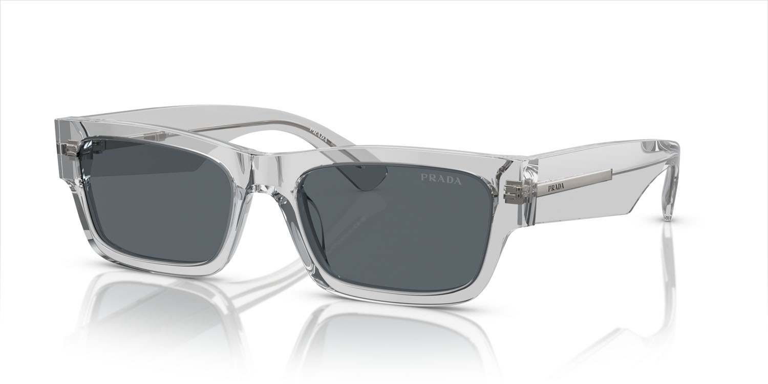Occhiali da sole Prada PR A03S (17P0A9) colore grigio crystal forma rettangolare lenti blu