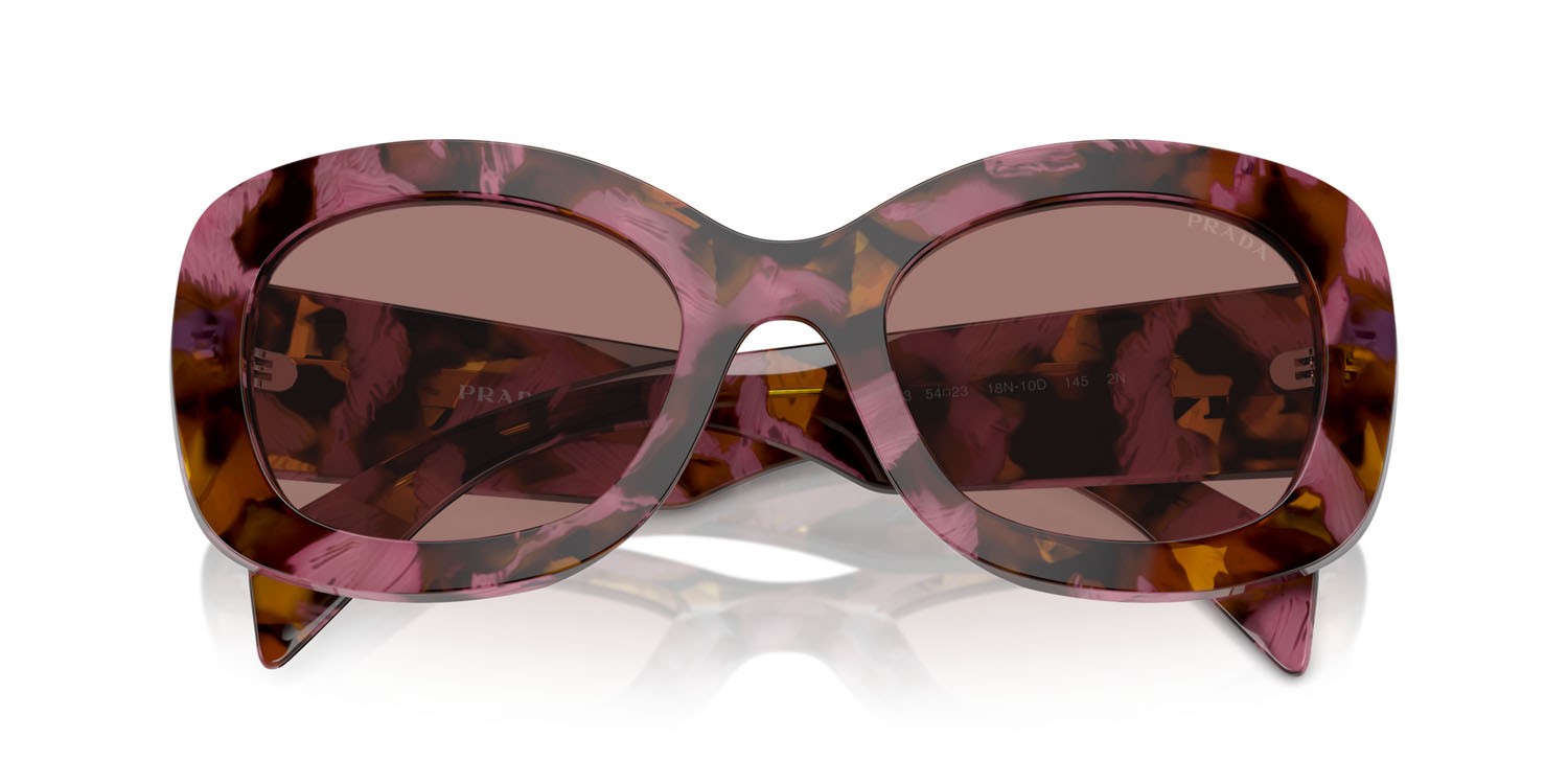 Occhiali da sole Prada PR A13S (18N10D) colore begonia cognac tartarugato forma ovale lenti marrone chiaro