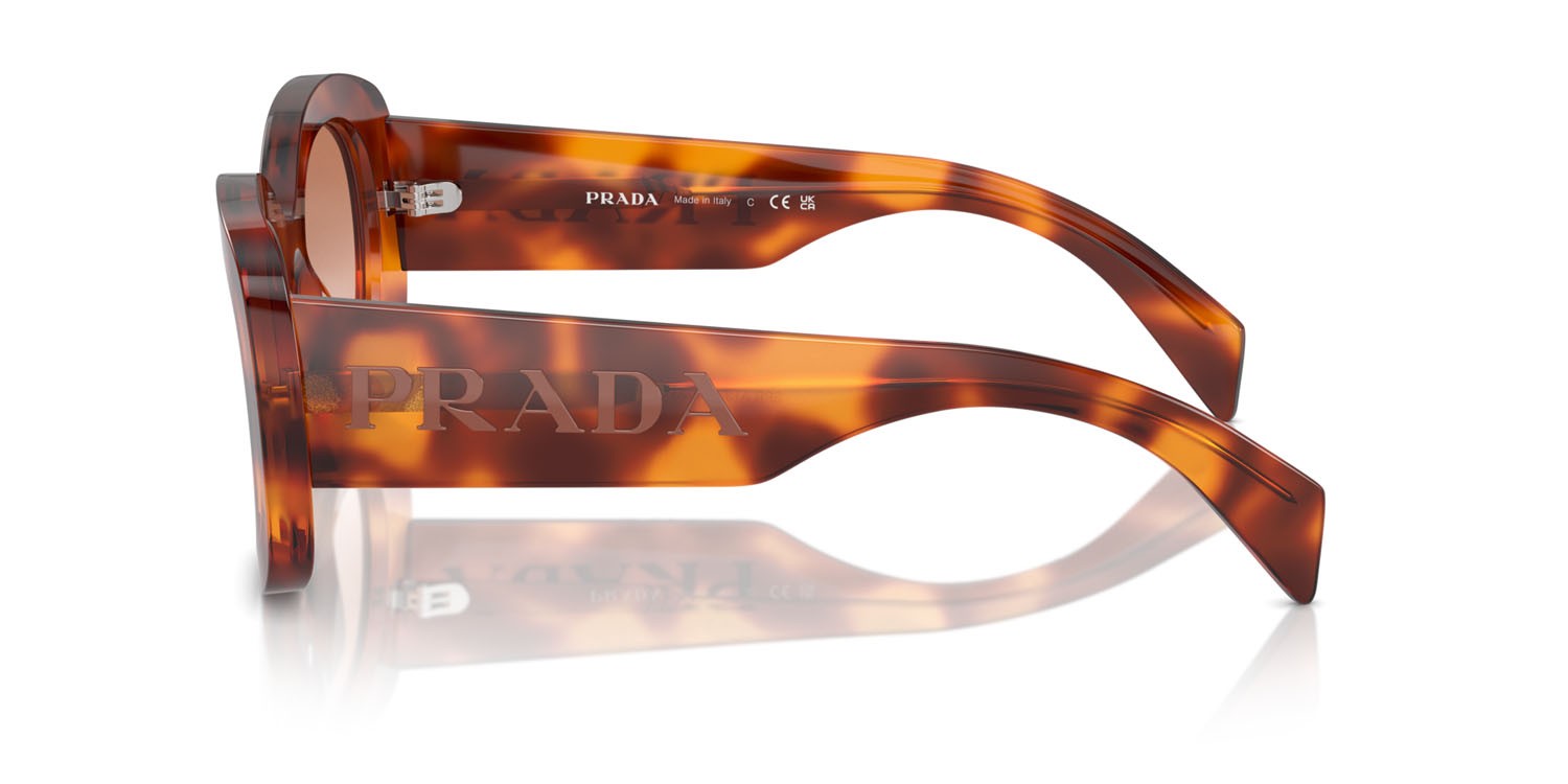 Sunglasses Prada PR A13S (18R70E) color cognac tartarugato shape oval lenses cognac sfumato ninfea