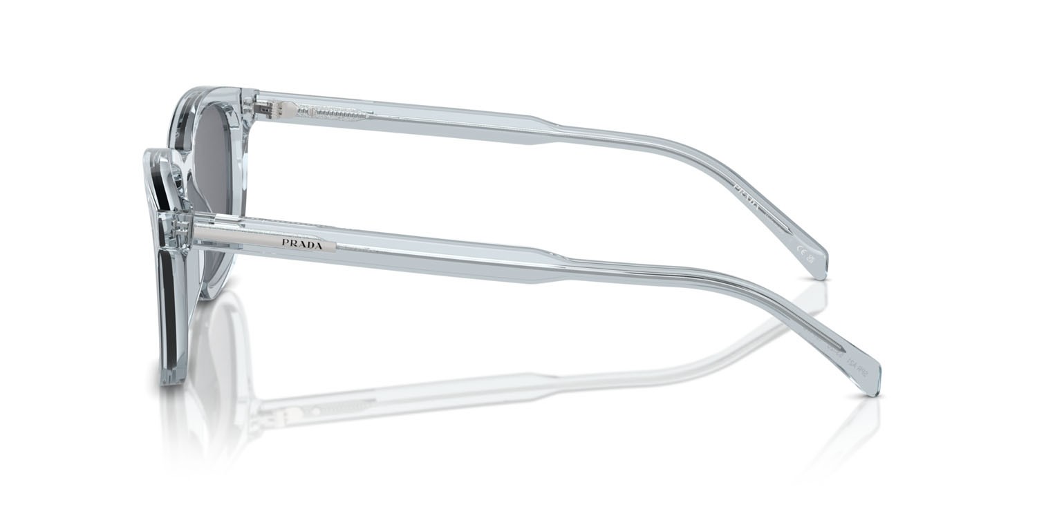 Occhiali da sole Prada PR A21S (19T175) colore azzurro trasparente forma quadrato lenti grigio scuro/flash argento