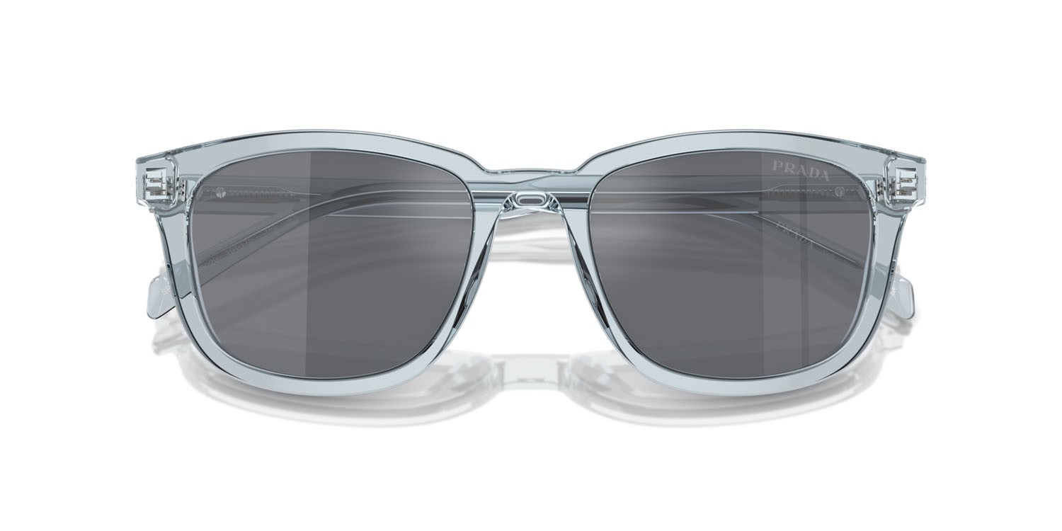 Occhiali da sole Prada PR A21S (19T175) colore azzurro trasparente forma quadrato lenti grigio scuro/flash argento
