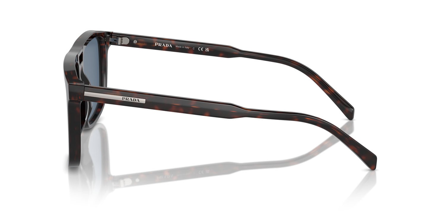 Occhiali da sole Prada PR A22S (17N06A) colore radica tortoise forma rettangolare lenti blu scuro