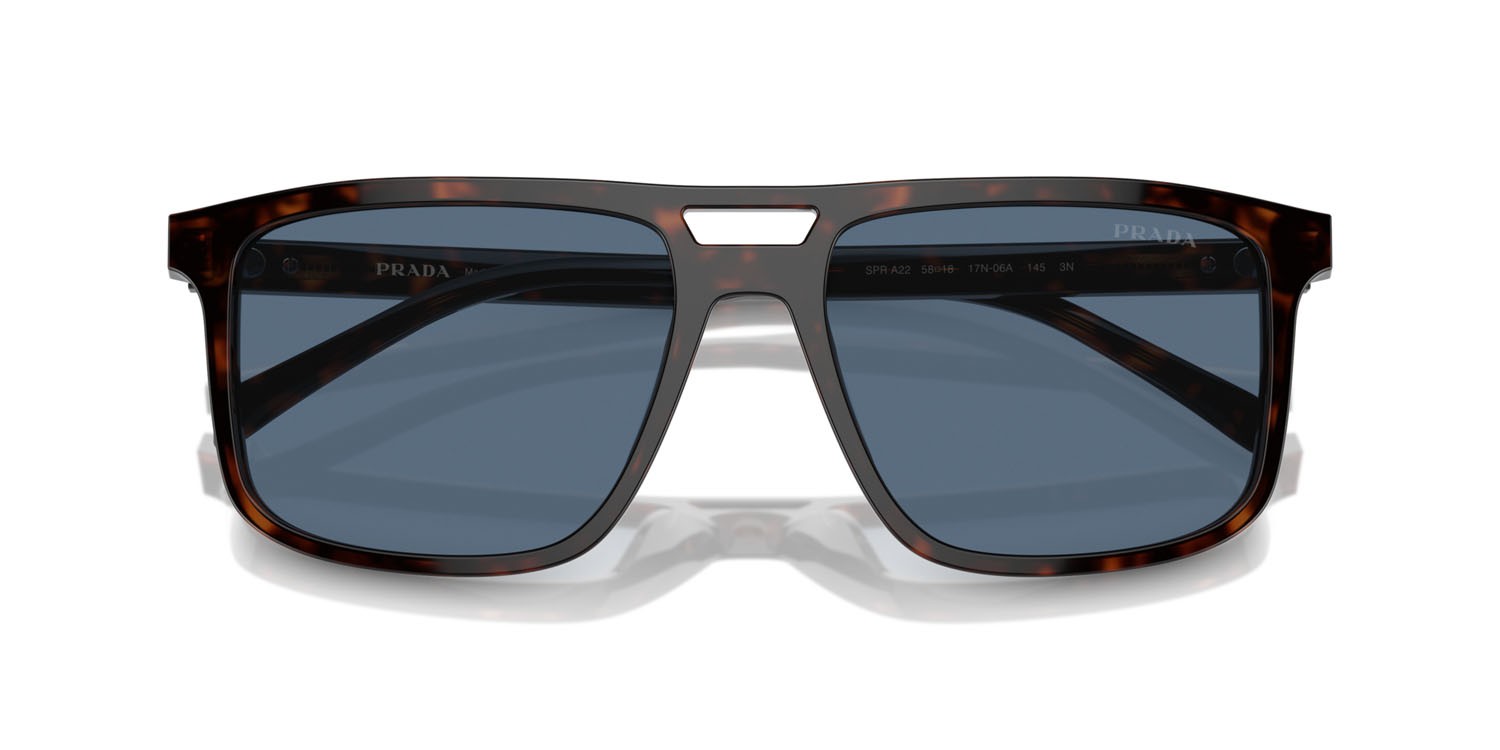 Occhiali da sole Prada PR A22S (17N06A) colore radica tortoise forma rettangolare lenti blu scuro