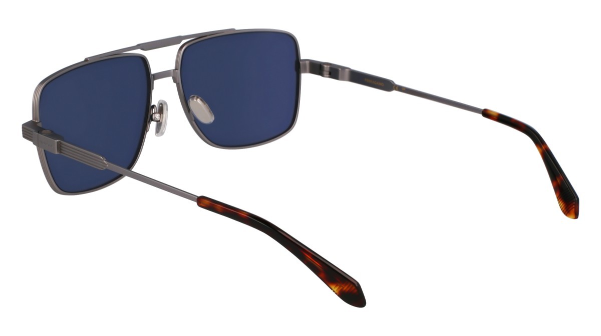 Occhiali da sole Salvatore Ferragamo SF318S (021) colore matte light ruthenium forma navigator lenti solid blue