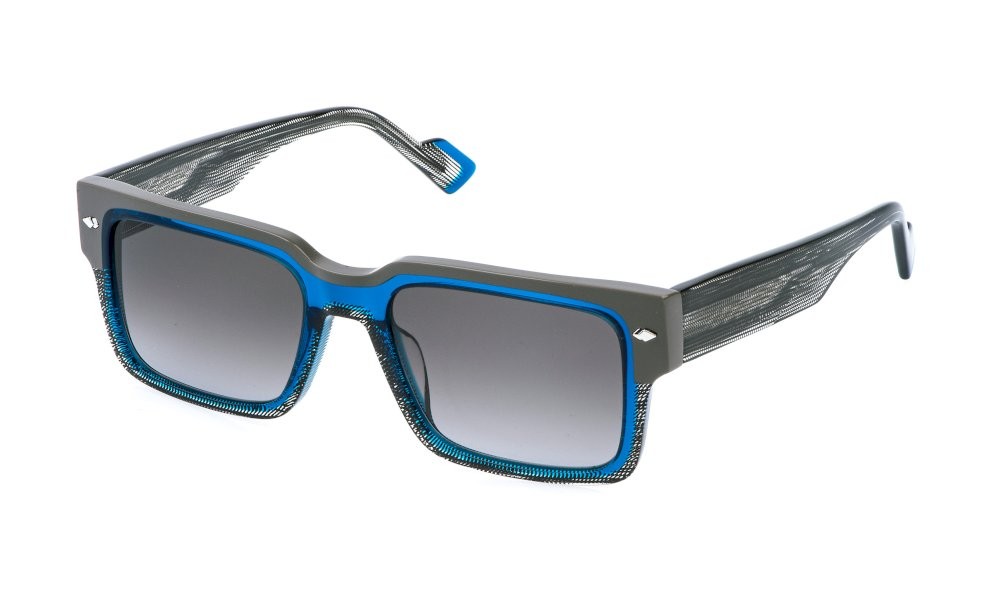 Occhiali da sole Sting SST557V (0W47) colore blu trasparente lucido lenti smoke gradient blue