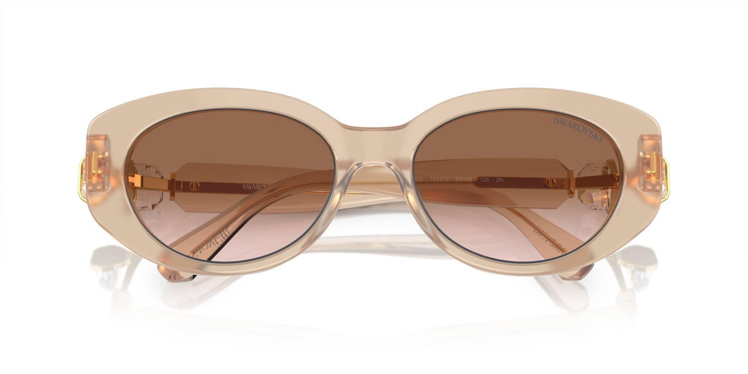 Sunglasses Swarovski SK 6002 (103413) color beige trasparente shape oval lenses marrone sfumato