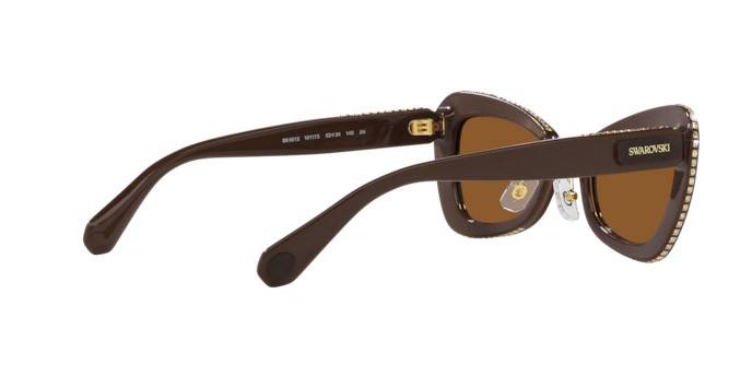 Sunglasses Swarovski SK 6012 (101173) color marrone/marrone chiaro shape irregular lenses marrone scuro