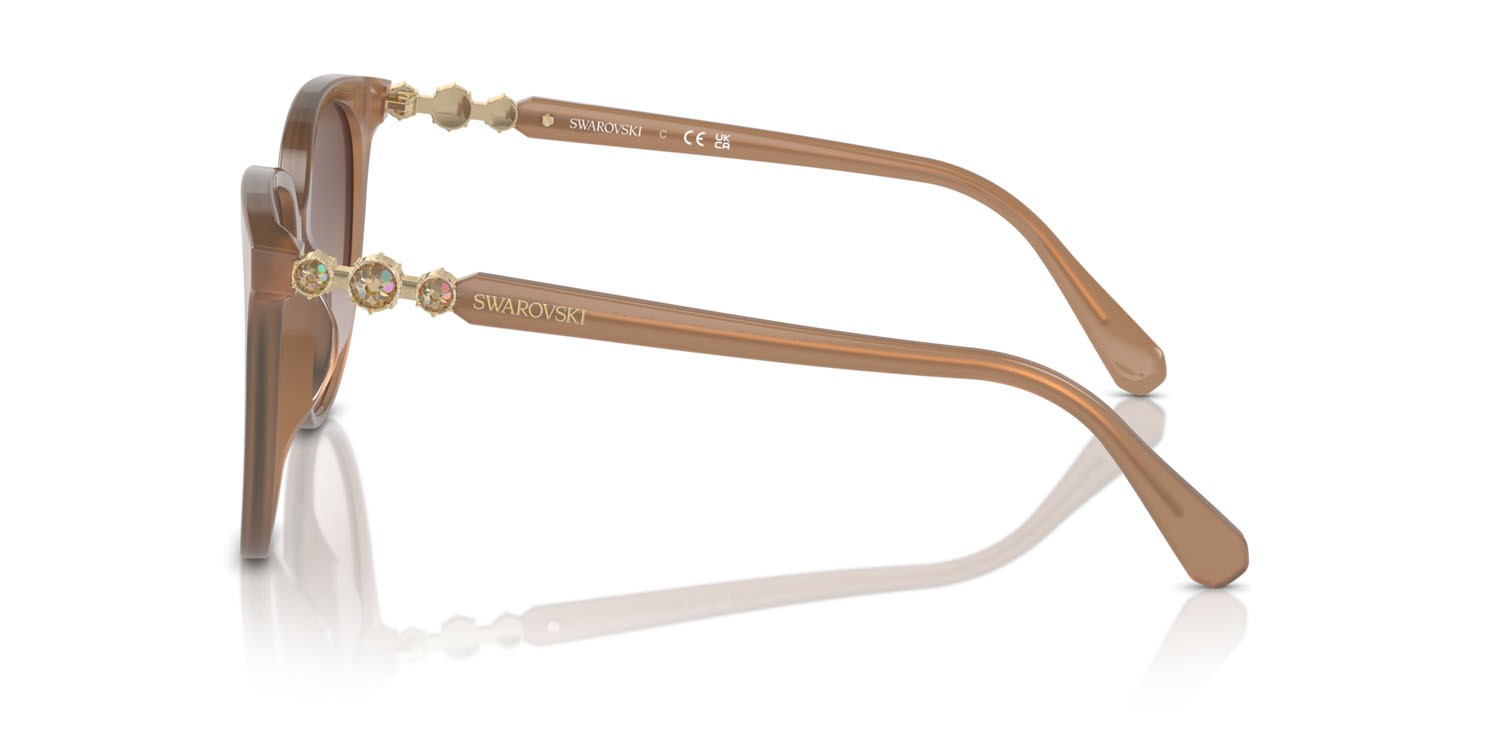 Sunglasses Swarovski SK 6023D (200213) color beige opalino shape irregular lenses marrone sfumato