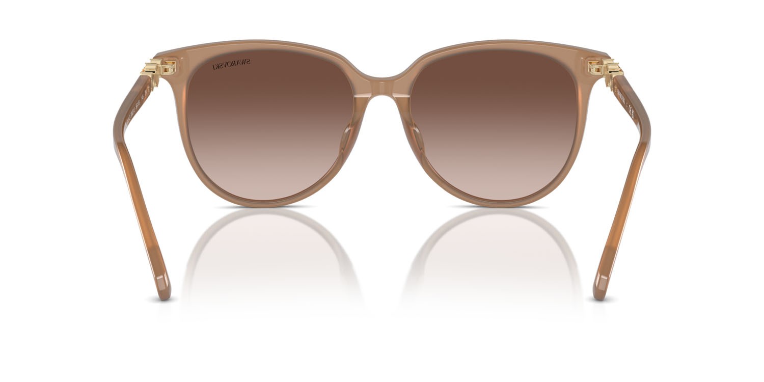 Sunglasses Swarovski SK 6023D (200213) color beige opalino shape irregular lenses marrone sfumato