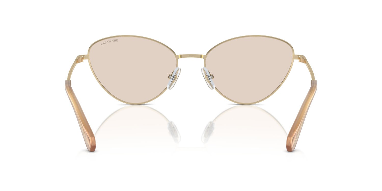 Occhiali da sole Swarovski SK 7014 (4013M4) colore oro pallido forma cat eye lenti fotocromatica marrone