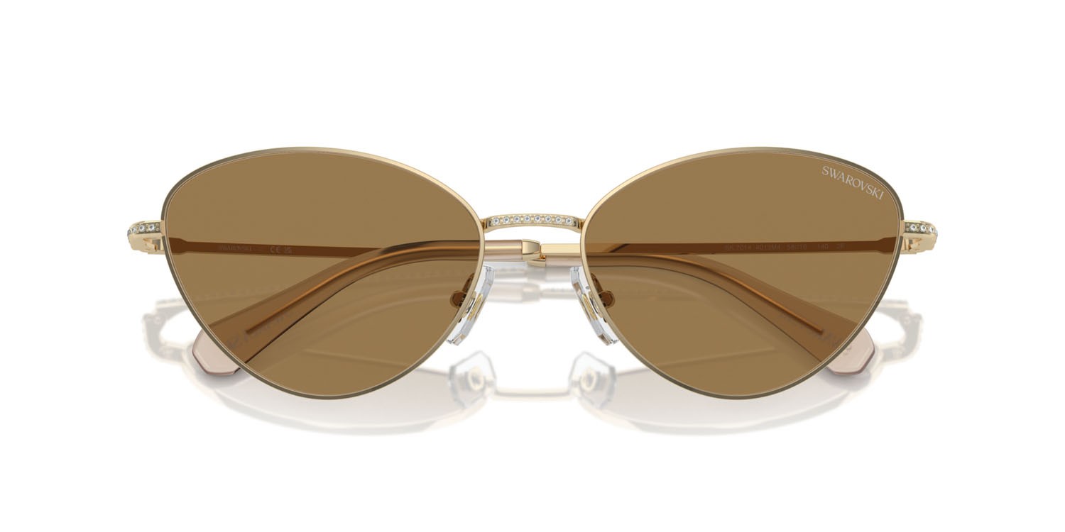 Occhiali da sole Swarovski SK 7014 (4013M4) colore oro pallido forma cat eye lenti fotocromatica marrone