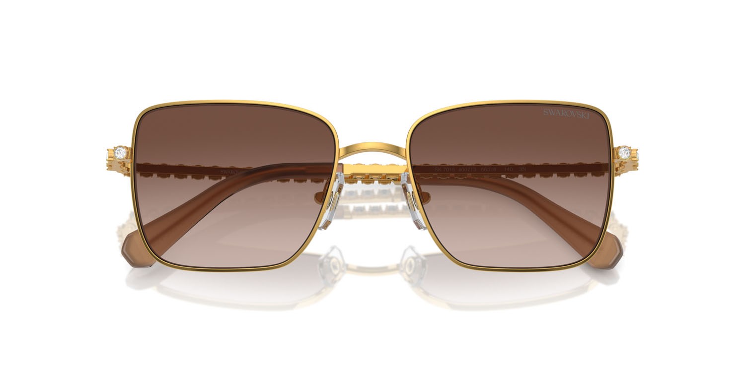Sunglasses Swarovski SK 7015 (400713) color giallo oro shape round lenses marrone sfumato