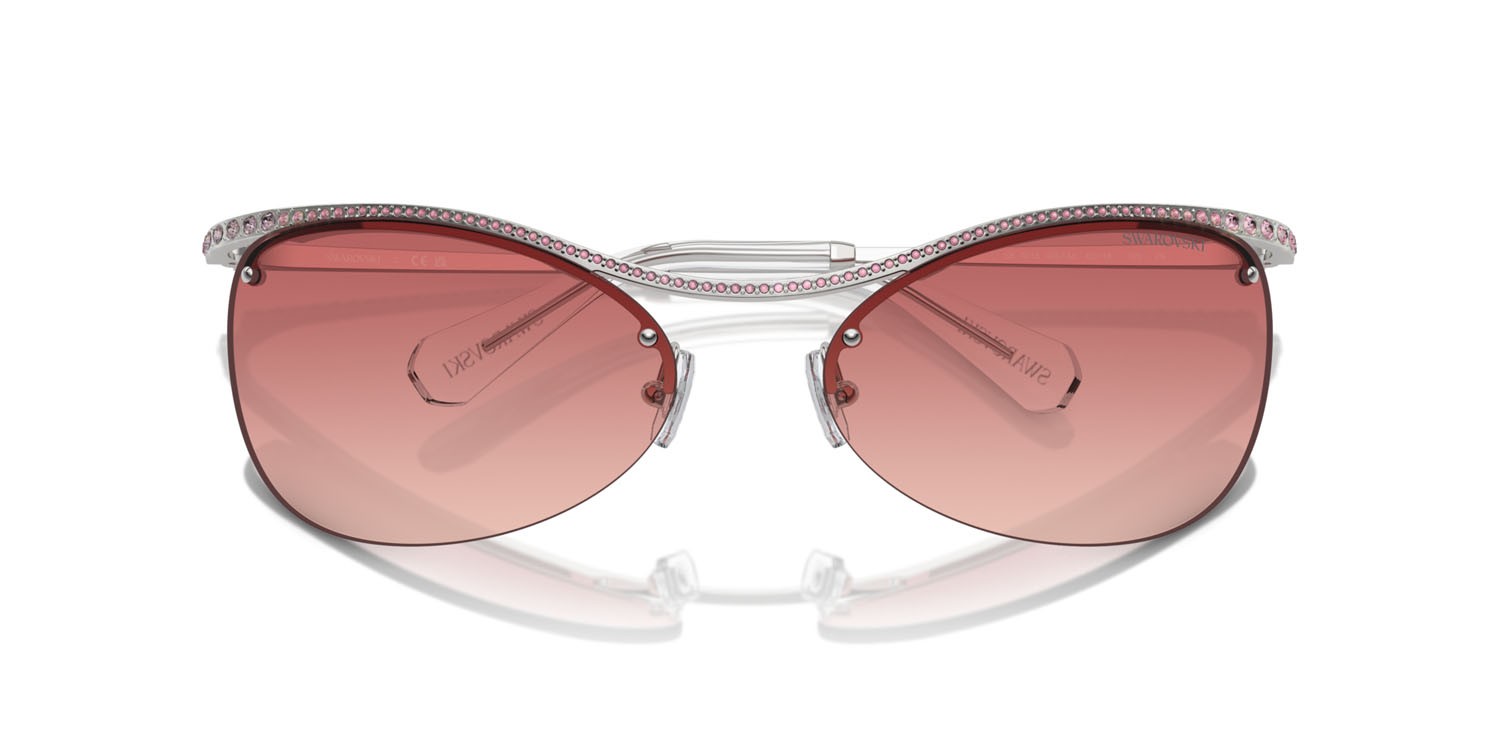 Occhiali da sole Swarovski SK 7018 (4001A5) colore argento forma irregolare lenti rosa sfumato rosso