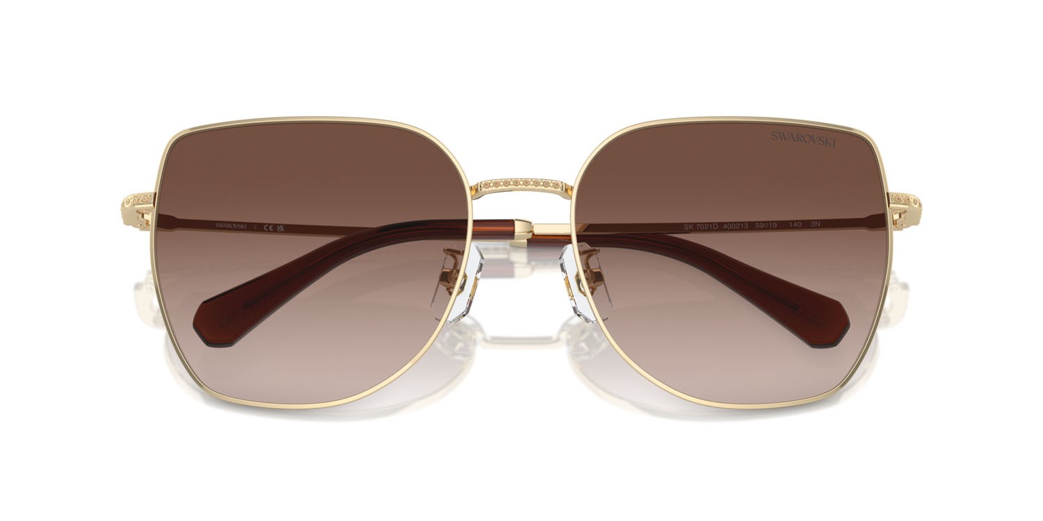 Occhiali da sole Swarovski SK 7021D (400213) colore oro pallido forma irregolare lenti marrone sfumato