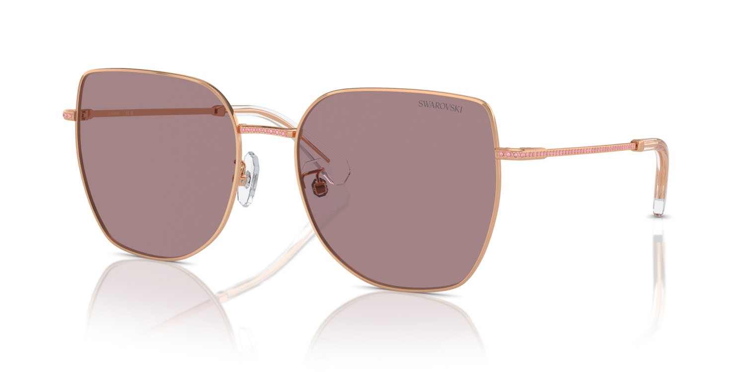 Occhiali da sole Swarovski SK 7021D (40147N) colore oro rose forma irregolare lenti viola chiaro/marrone