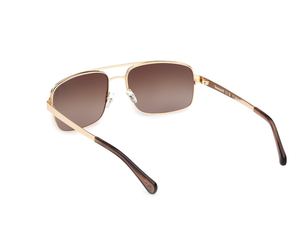 Sunglasses Timberland TB00065 (32H) color oro pallido lucido shape navigator lenses marrone polar.