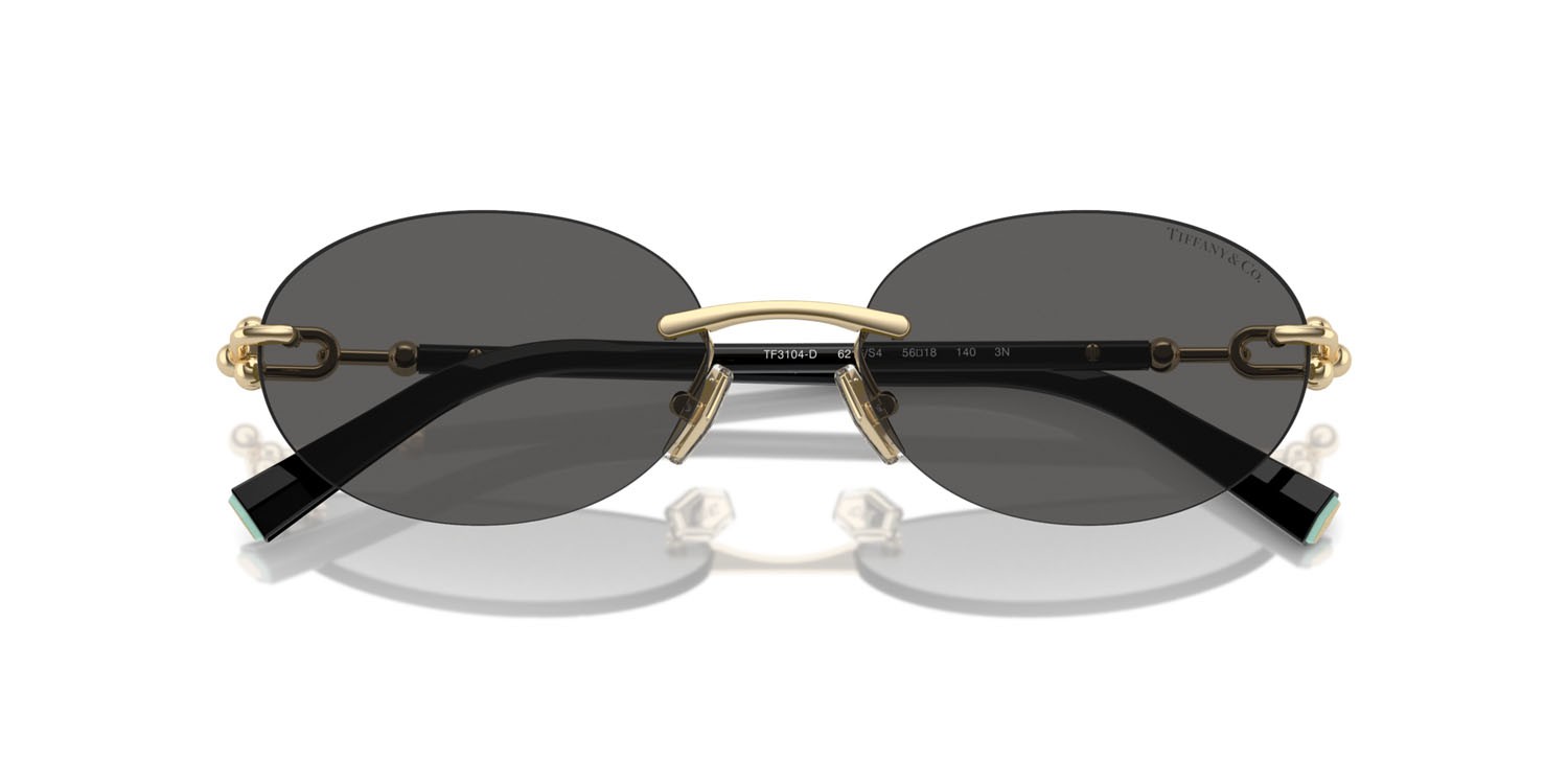 Occhiali da sole Tiffany TF 3104D (6216S4) colore oro pallido forma ovale lenti grigio scuro