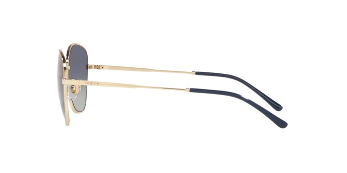 Occhiali da sole Vogue VO 4232S (848/4L) colore pale gold forma farfalla lenti grey gradient dark blue