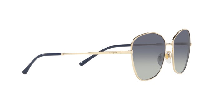 Occhiali da sole Vogue VO 4232S (848/4L) colore pale gold forma farfalla lenti grey gradient dark blue